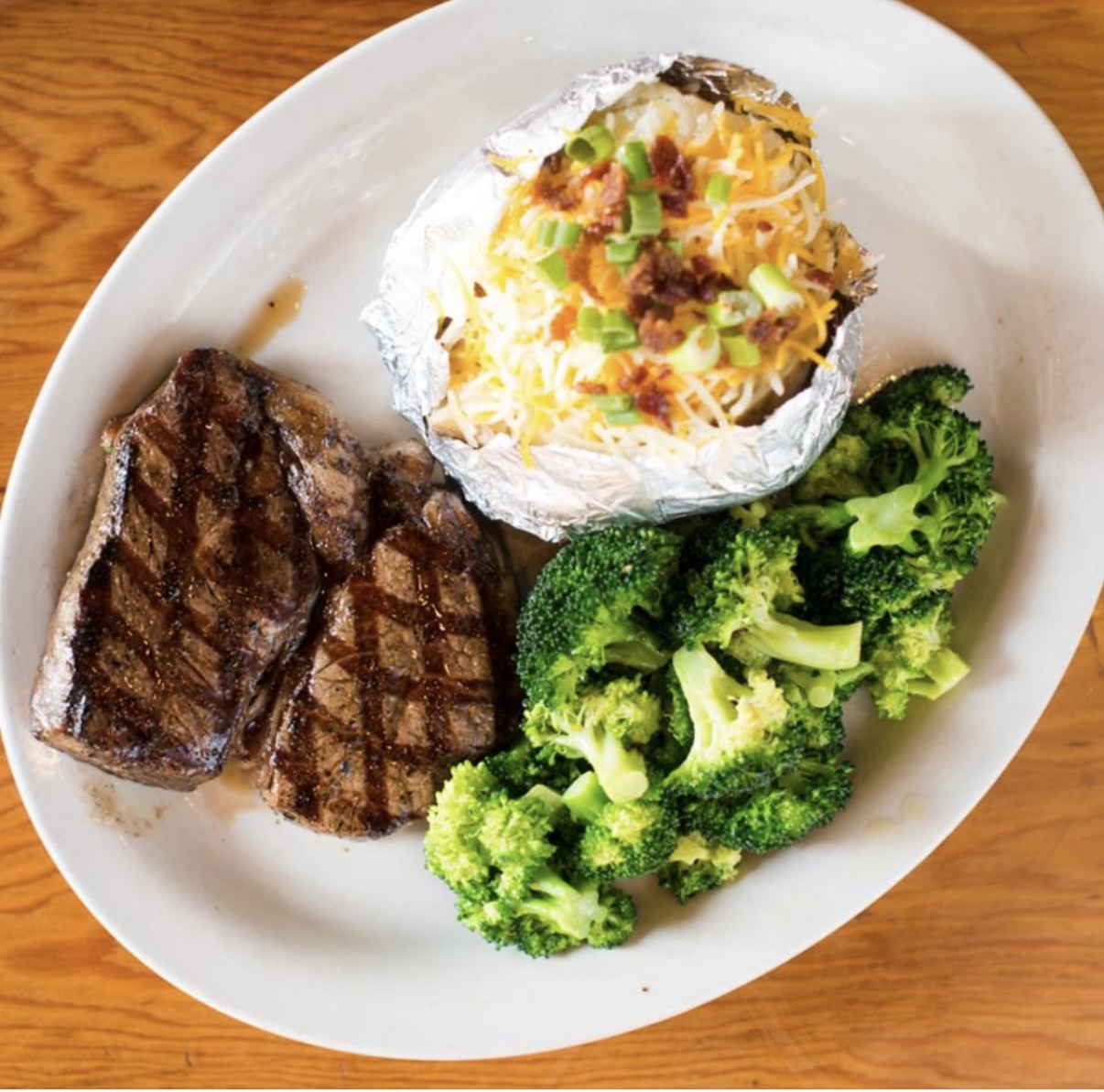 Sirloin steak with baked potato and broccoli