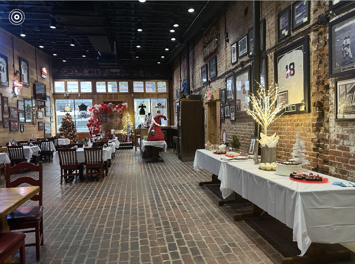 Cecil's private party room with brick walls and long tables